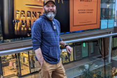 Ray-posing-in-front-of-Bourbon-signs