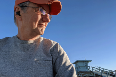 Tom-ear-buds-on-beach