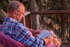 Tom-reading-on-goat-farm-porch-Big-Sur