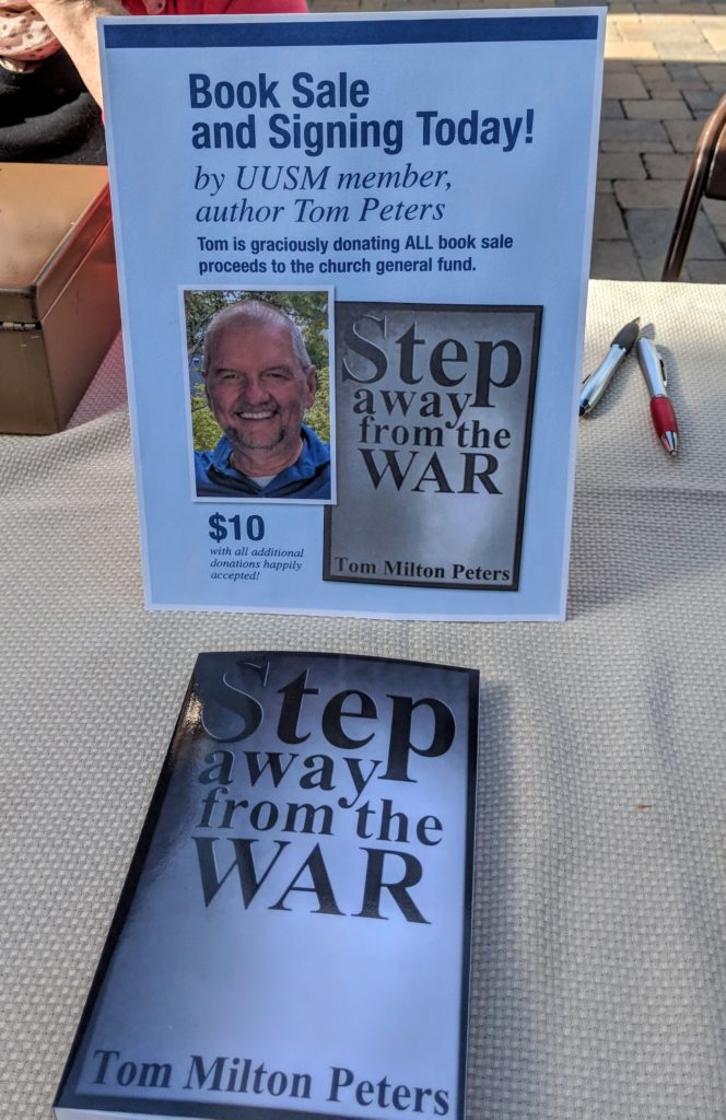 Tom Peters's memoir "Step Away from the War" laying on a book-signing table