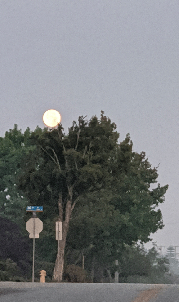 Full moon on above street corner
