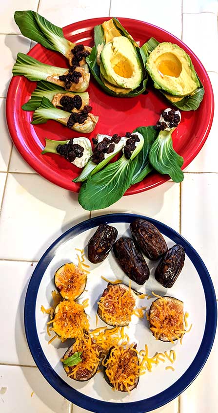 Healthy breakfast of Baby Bok choy, cup ends w peanut butter and raisins, cream cheese/raisins, leaf end used w spicy mayo and fresh avocado filled with truffle honey. Figs w cheddar cheese (torched) and fresh dates.